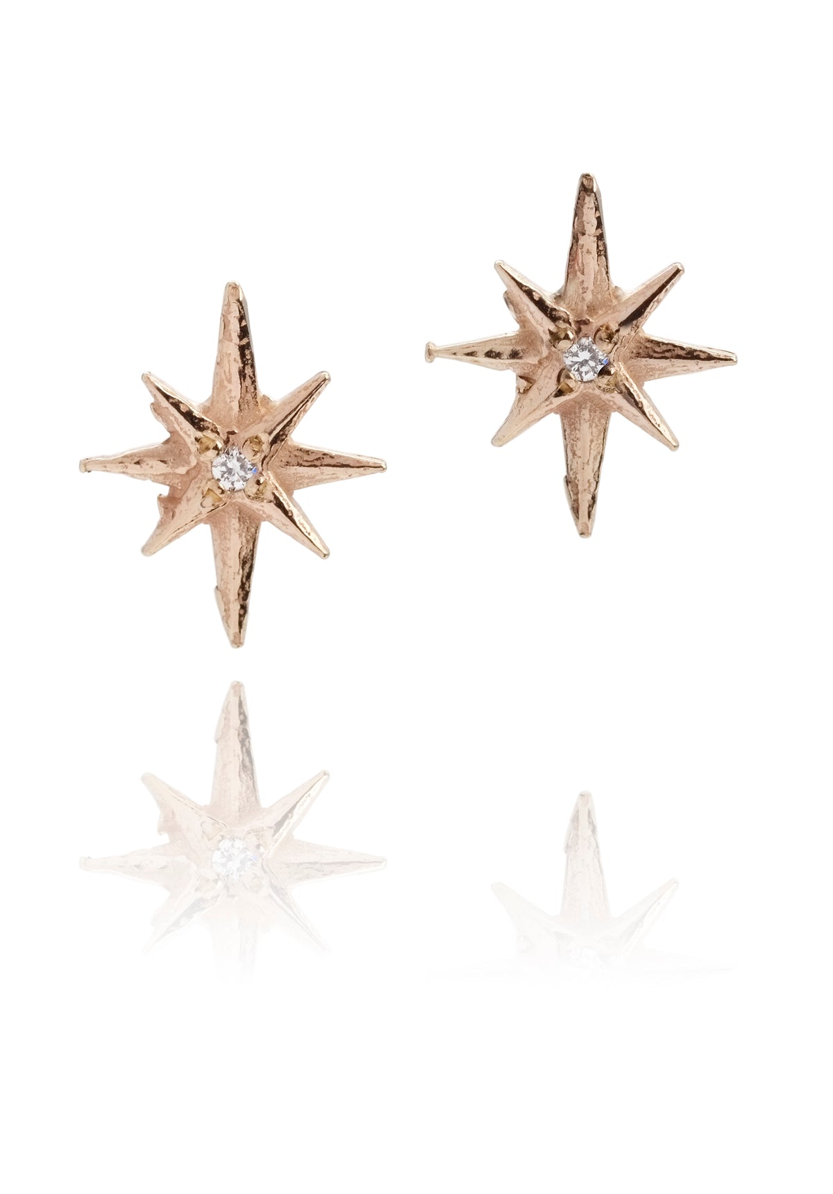 Gold star earstuds with diamonds