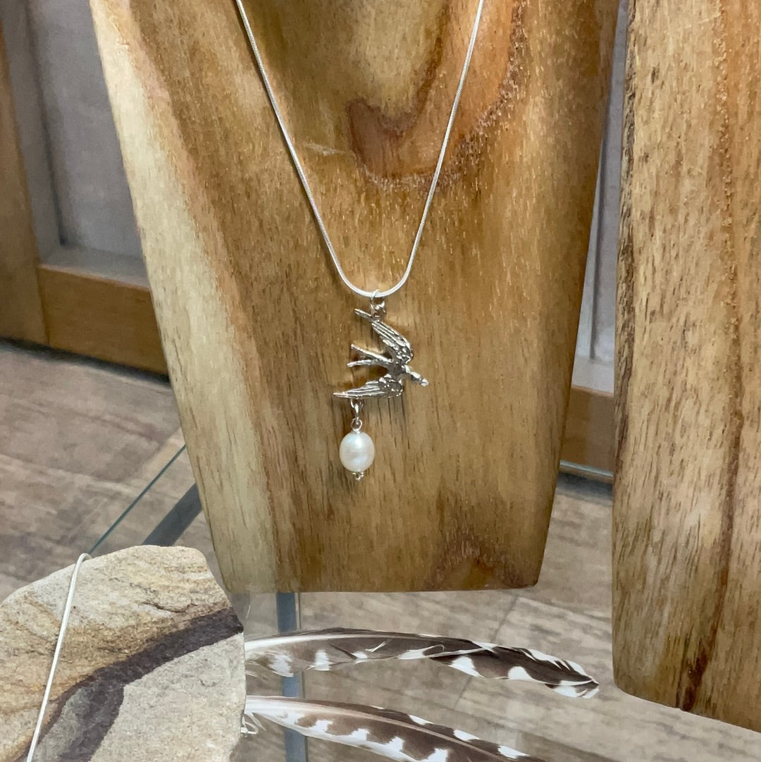 Swallow and pearl pendant