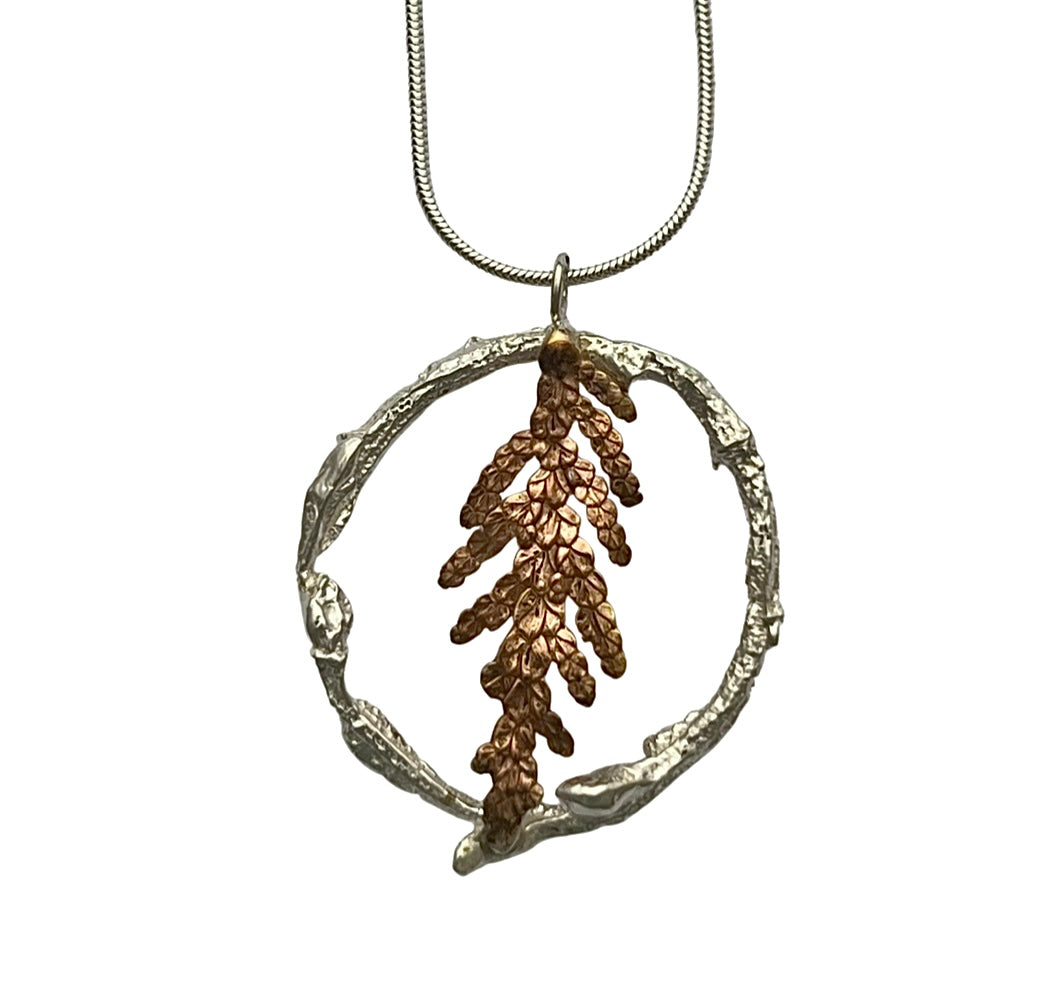 Fern in a twig circcle pendant